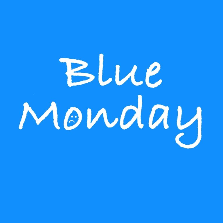 Blauwe achtergrond met witte tekst "Blue Monday" en een klein gezichtje