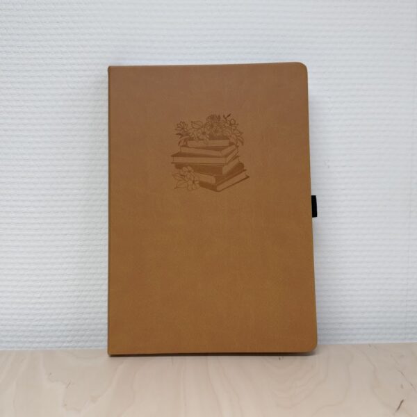 Bruin notitieboek met bloemen- en boekenillustratie op de voorkant
