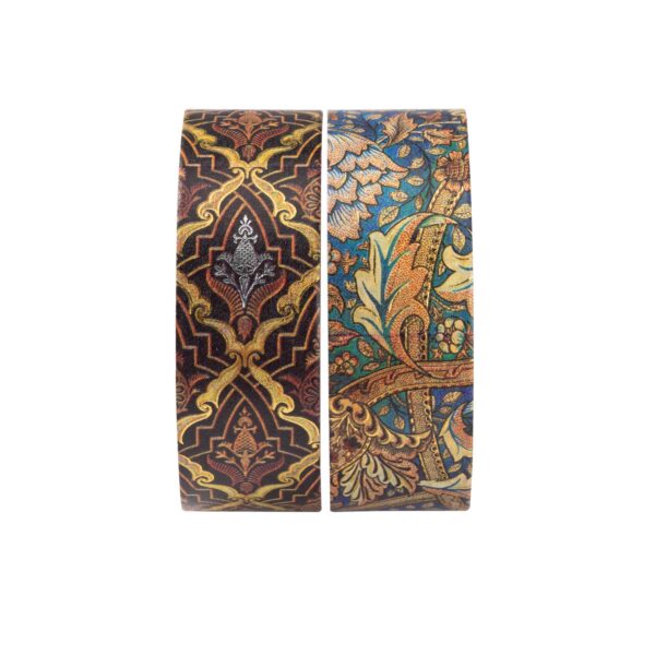 Twee rollen washi tape met gedetailleerde ornamentale patronen op witte achtergrond