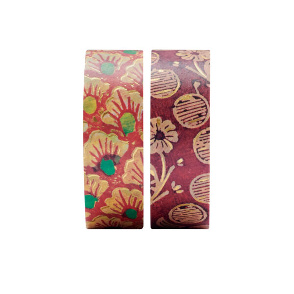 Twee rollen washi tape met bloemen- en cirkelpatronen op witte achtergrond